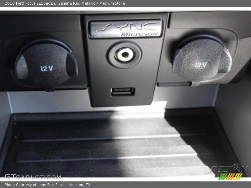 Sangria Red Metallic / Medium Stone 2010 Ford Focus SEL Sedan