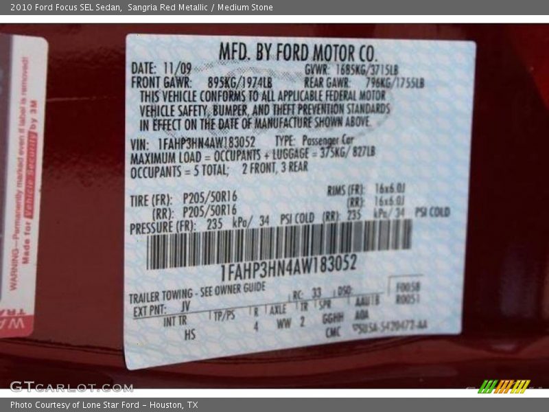 Sangria Red Metallic / Medium Stone 2010 Ford Focus SEL Sedan