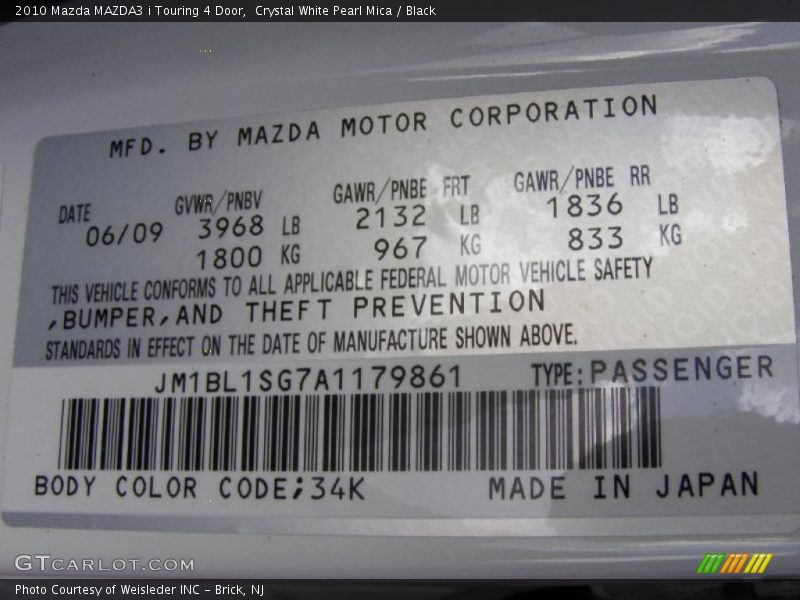 Crystal White Pearl Mica / Black 2010 Mazda MAZDA3 i Touring 4 Door