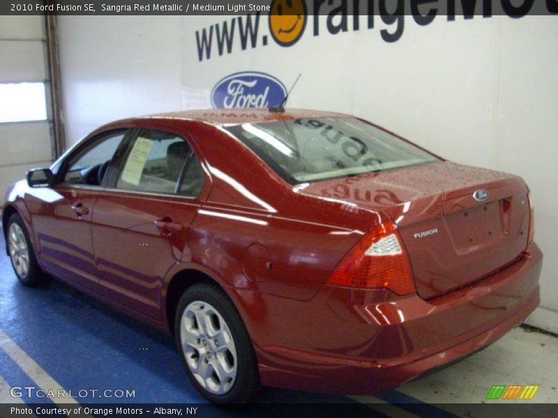 Sangria Red Metallic / Medium Light Stone 2010 Ford Fusion SE