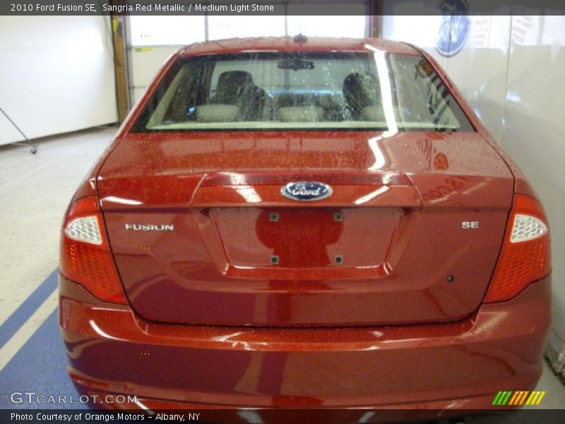 Sangria Red Metallic / Medium Light Stone 2010 Ford Fusion SE