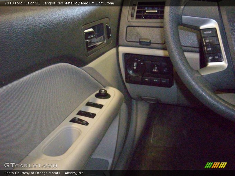 Sangria Red Metallic / Medium Light Stone 2010 Ford Fusion SE