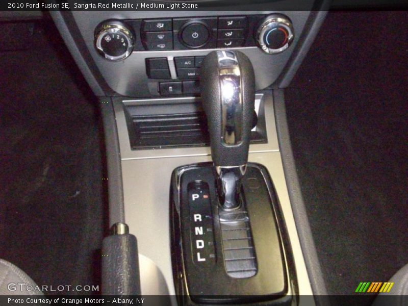 Sangria Red Metallic / Medium Light Stone 2010 Ford Fusion SE