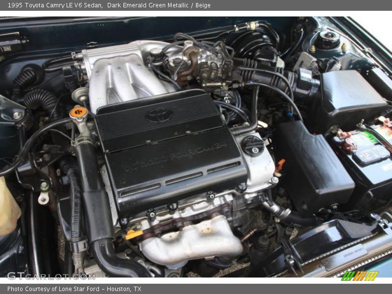 Dark Emerald Green Metallic / Beige 1995 Toyota Camry LE V6 Sedan