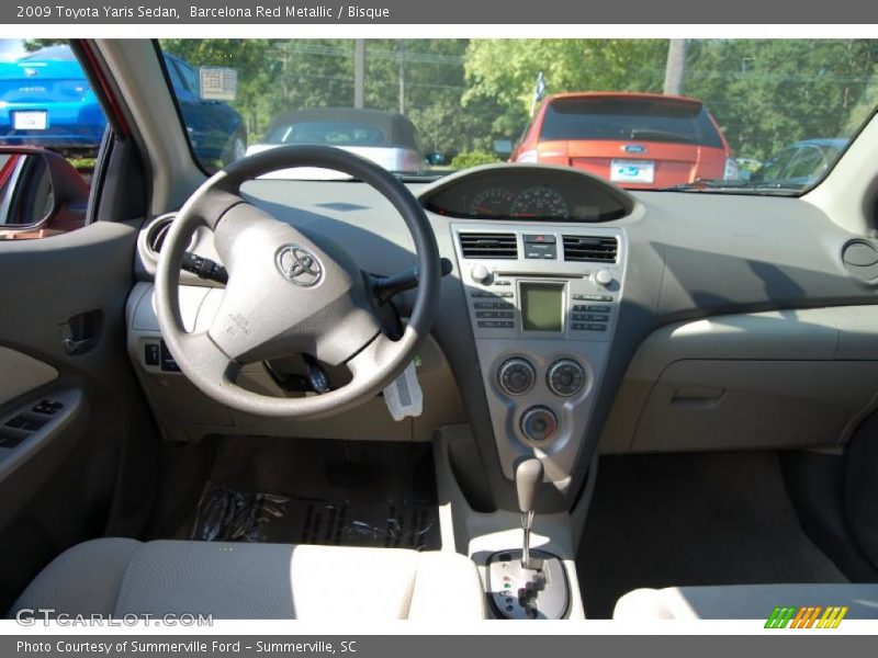 Barcelona Red Metallic / Bisque 2009 Toyota Yaris Sedan