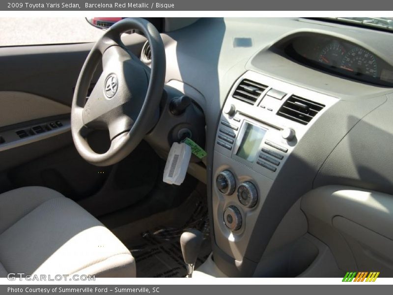 Barcelona Red Metallic / Bisque 2009 Toyota Yaris Sedan