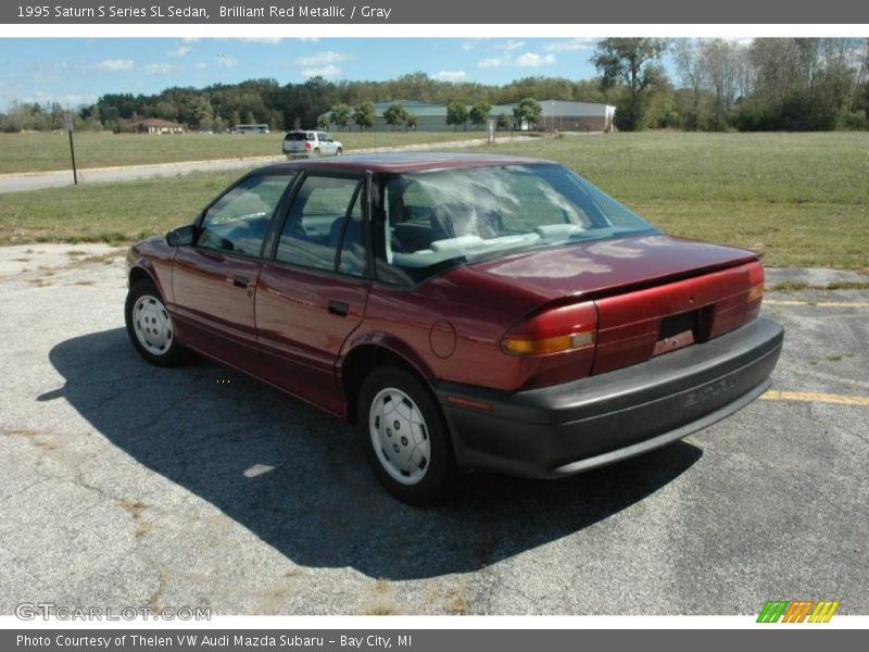 Brilliant Red Metallic / Gray 1995 Saturn S Series SL Sedan