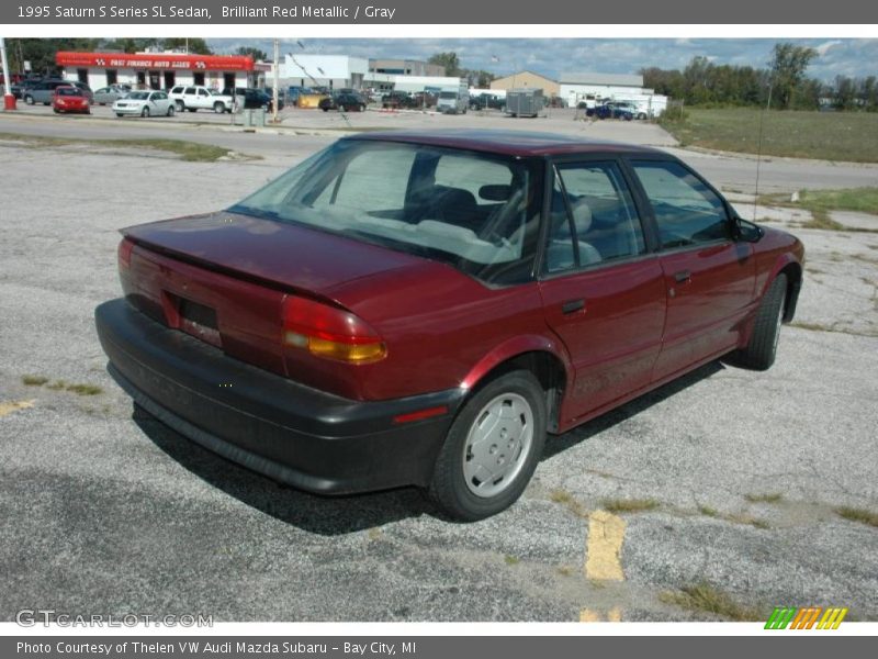 Brilliant Red Metallic / Gray 1995 Saturn S Series SL Sedan