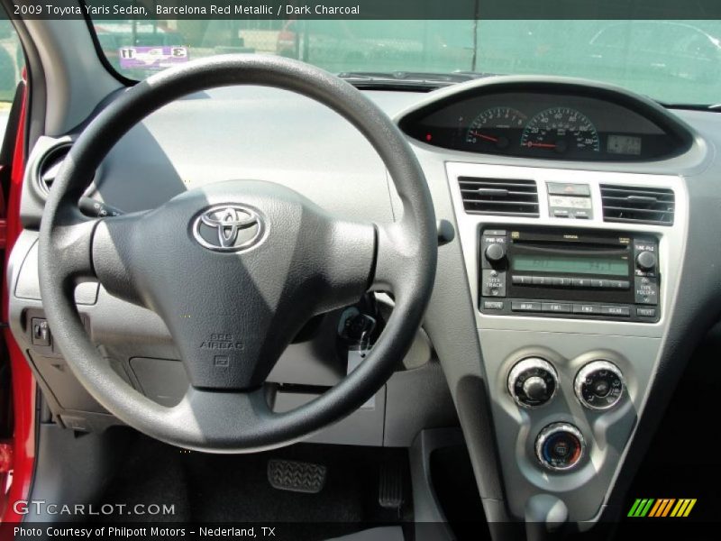 Barcelona Red Metallic / Dark Charcoal 2009 Toyota Yaris Sedan