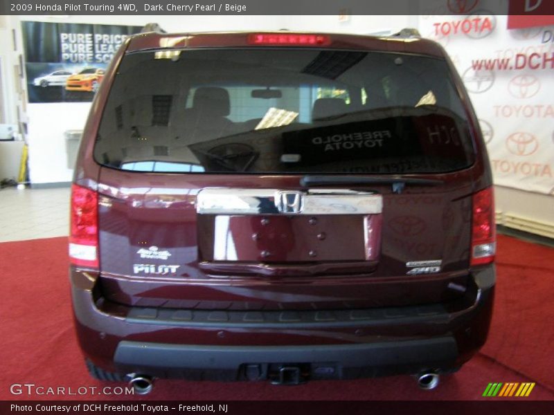 Dark Cherry Pearl / Beige 2009 Honda Pilot Touring 4WD