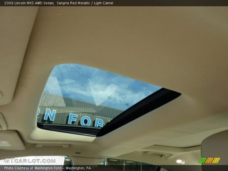 Sangria Red Metallic / Light Camel 2009 Lincoln MKS AWD Sedan