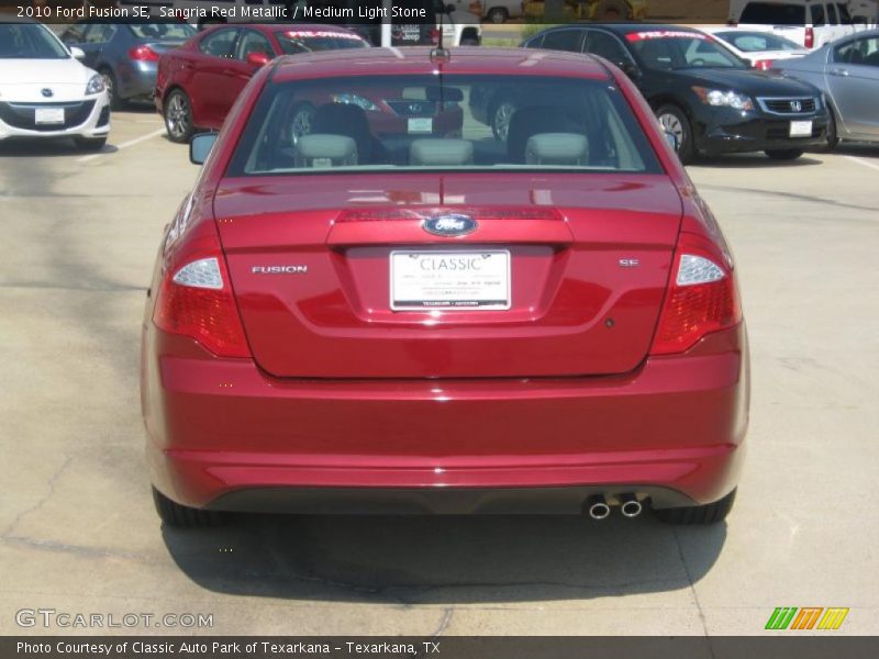 Sangria Red Metallic / Medium Light Stone 2010 Ford Fusion SE