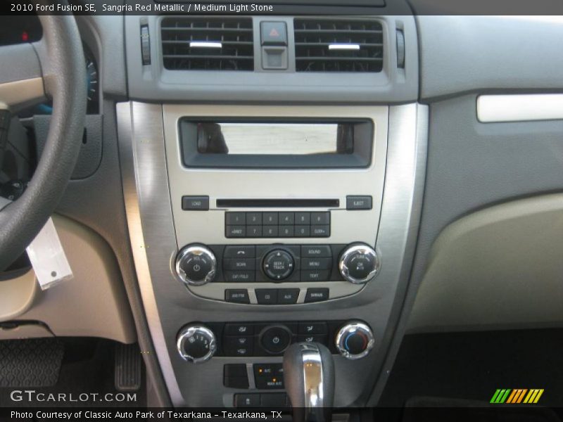 Sangria Red Metallic / Medium Light Stone 2010 Ford Fusion SE