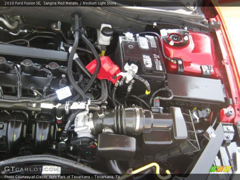 Sangria Red Metallic / Medium Light Stone 2010 Ford Fusion SE