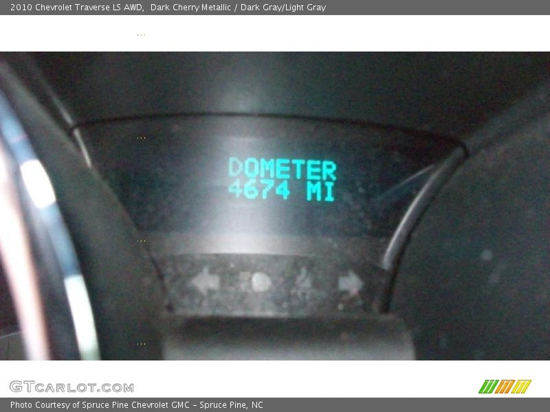 Dark Cherry Metallic / Dark Gray/Light Gray 2010 Chevrolet Traverse LS AWD