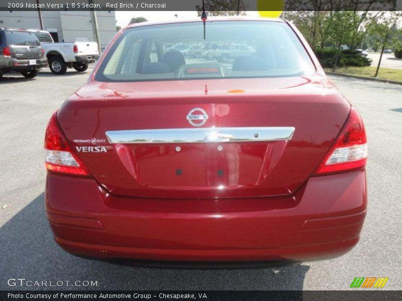 Red Brick / Charcoal 2009 Nissan Versa 1.8 S Sedan