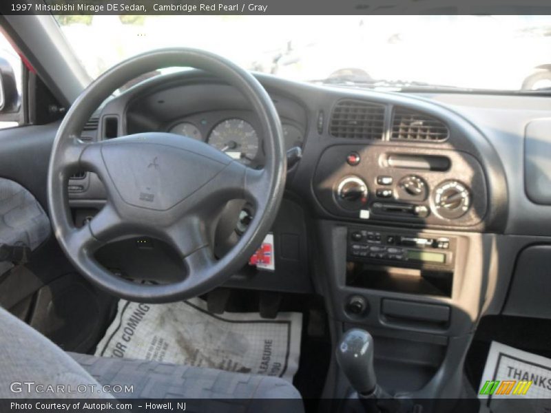 Cambridge Red Pearl / Gray 1997 Mitsubishi Mirage DE Sedan