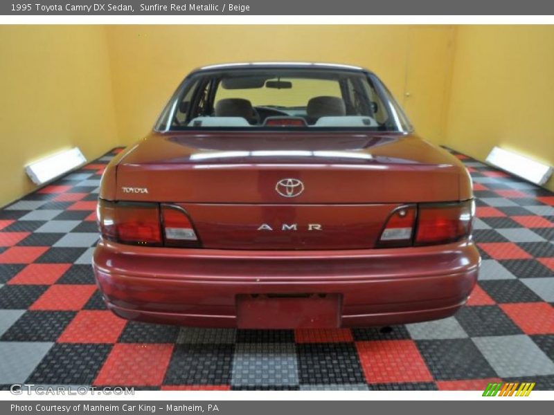 Sunfire Red Metallic / Beige 1995 Toyota Camry DX Sedan