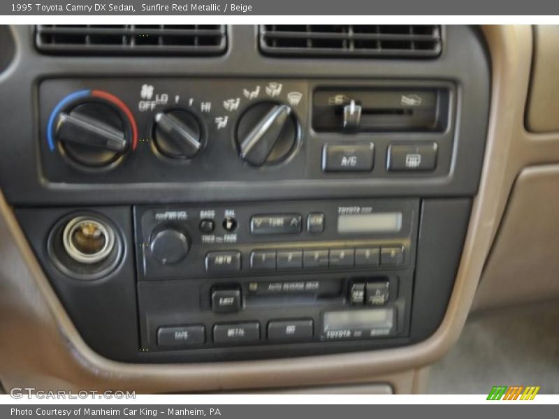 Sunfire Red Metallic / Beige 1995 Toyota Camry DX Sedan