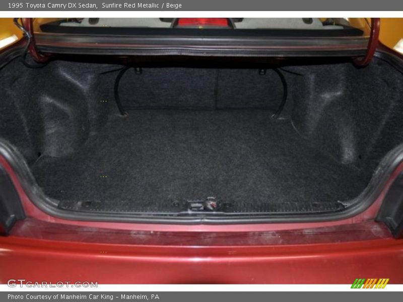 Sunfire Red Metallic / Beige 1995 Toyota Camry DX Sedan