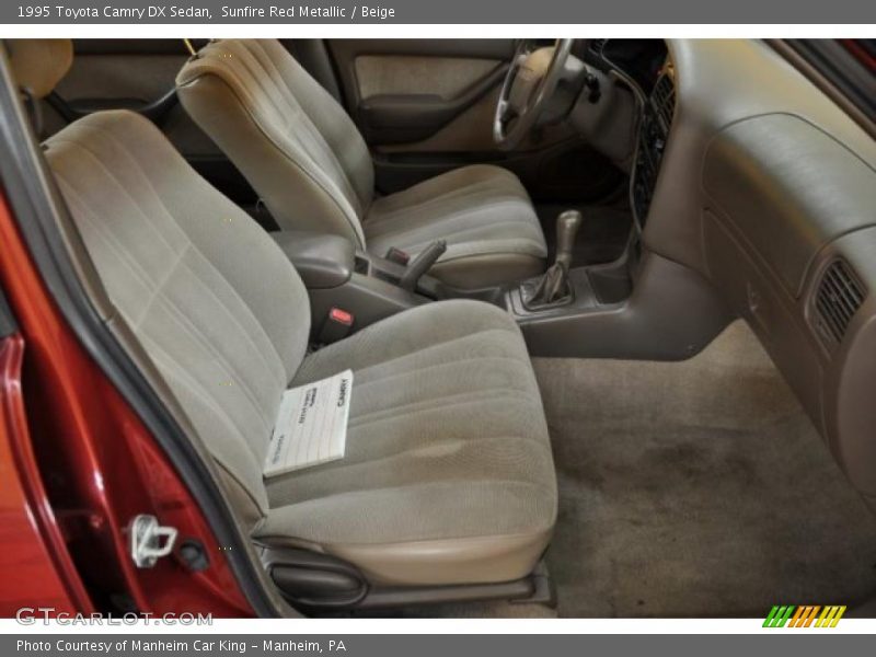 Sunfire Red Metallic / Beige 1995 Toyota Camry DX Sedan