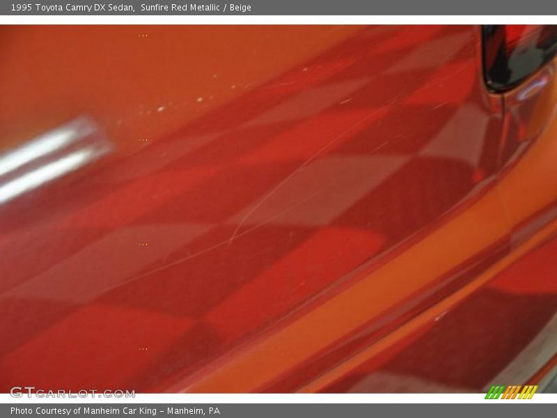 Sunfire Red Metallic / Beige 1995 Toyota Camry DX Sedan