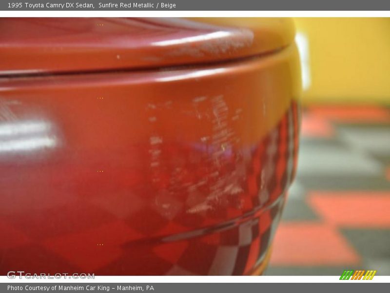 Sunfire Red Metallic / Beige 1995 Toyota Camry DX Sedan