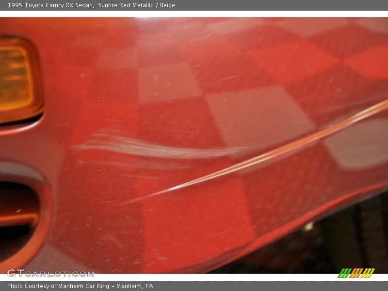 Sunfire Red Metallic / Beige 1995 Toyota Camry DX Sedan