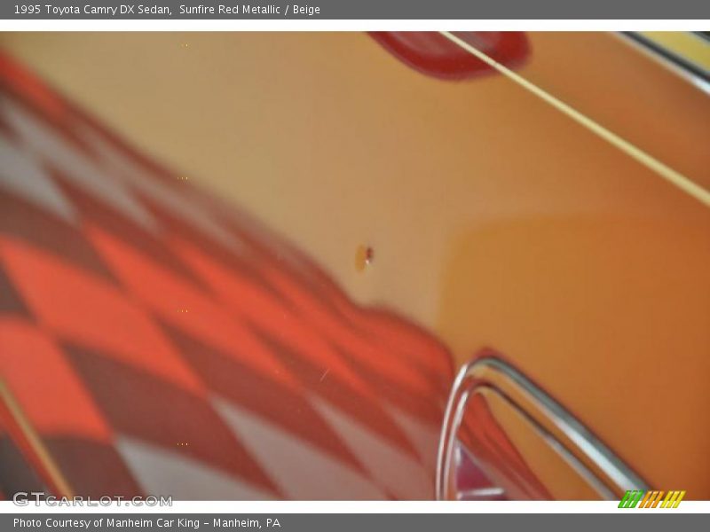 Sunfire Red Metallic / Beige 1995 Toyota Camry DX Sedan