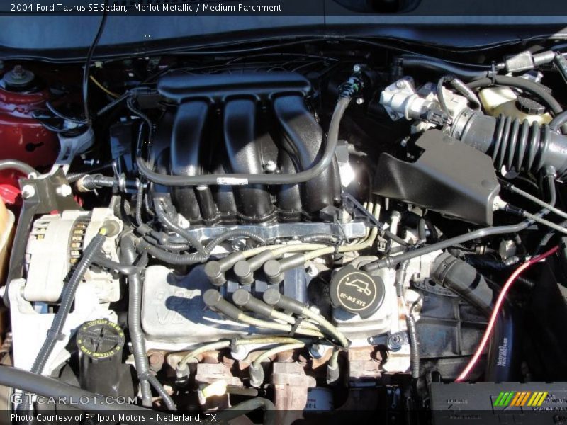 Merlot Metallic / Medium Parchment 2004 Ford Taurus SE Sedan