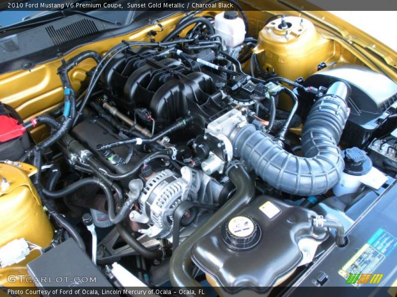 Sunset Gold Metallic / Charcoal Black 2010 Ford Mustang V6 Premium Coupe