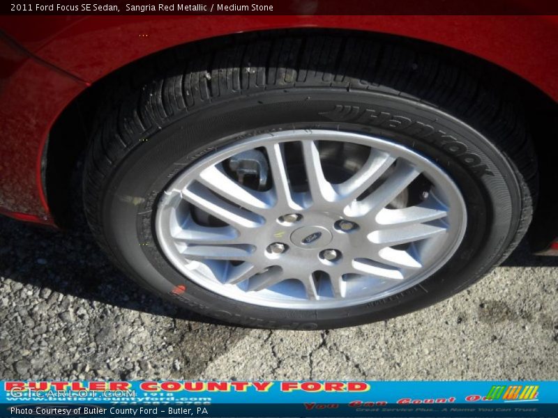 Sangria Red Metallic / Medium Stone 2011 Ford Focus SE Sedan
