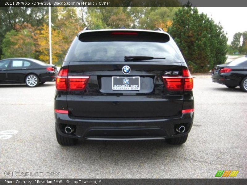 Black Sapphire Metallic / Oyster 2011 BMW X5 xDrive 35i