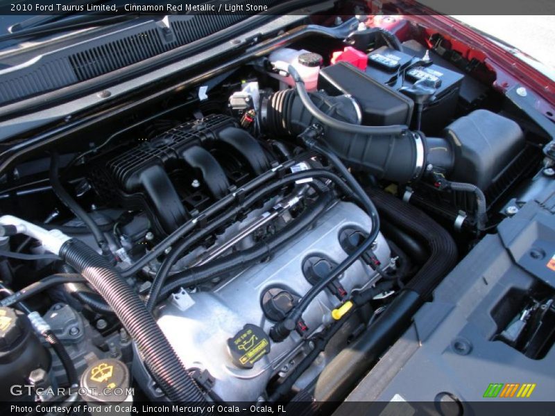 Cinnamon Red Metallic / Light Stone 2010 Ford Taurus Limited