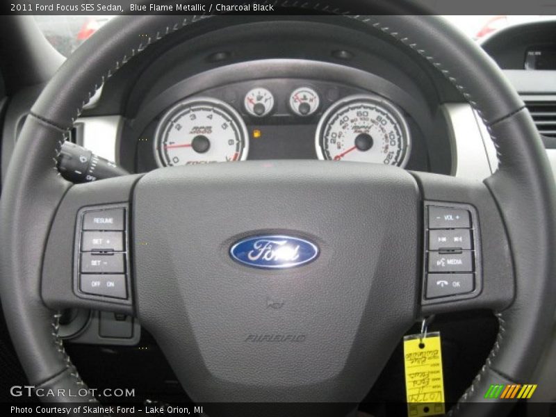 Blue Flame Metallic / Charcoal Black 2011 Ford Focus SES Sedan