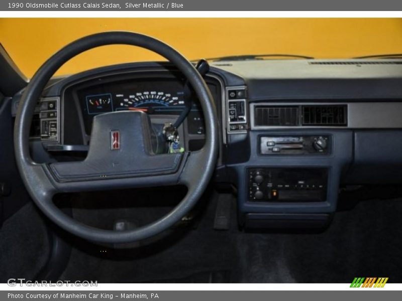 Silver Metallic / Blue 1990 Oldsmobile Cutlass Calais Sedan