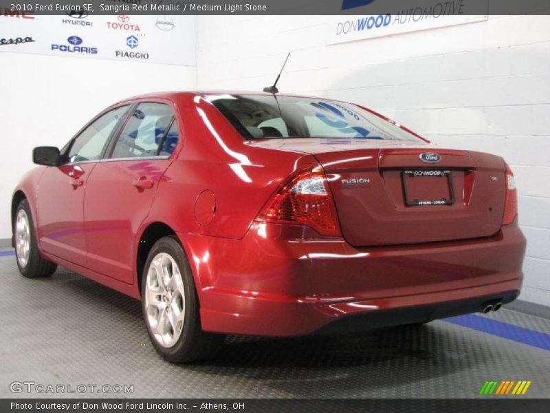 Sangria Red Metallic / Medium Light Stone 2010 Ford Fusion SE