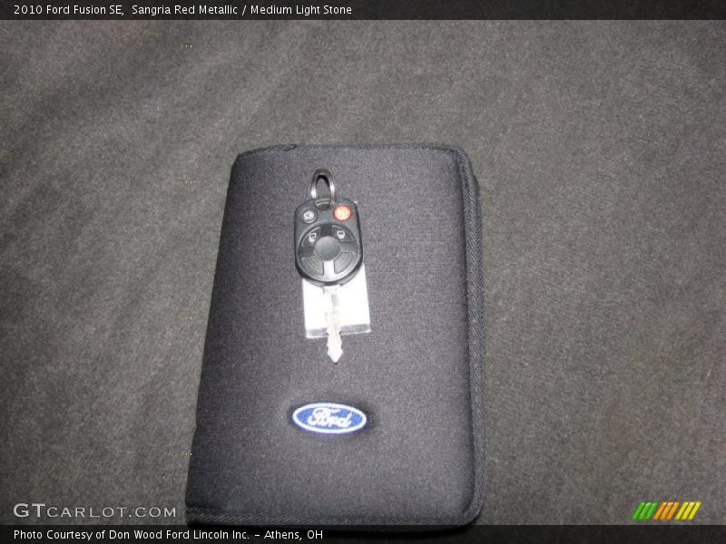 Sangria Red Metallic / Medium Light Stone 2010 Ford Fusion SE
