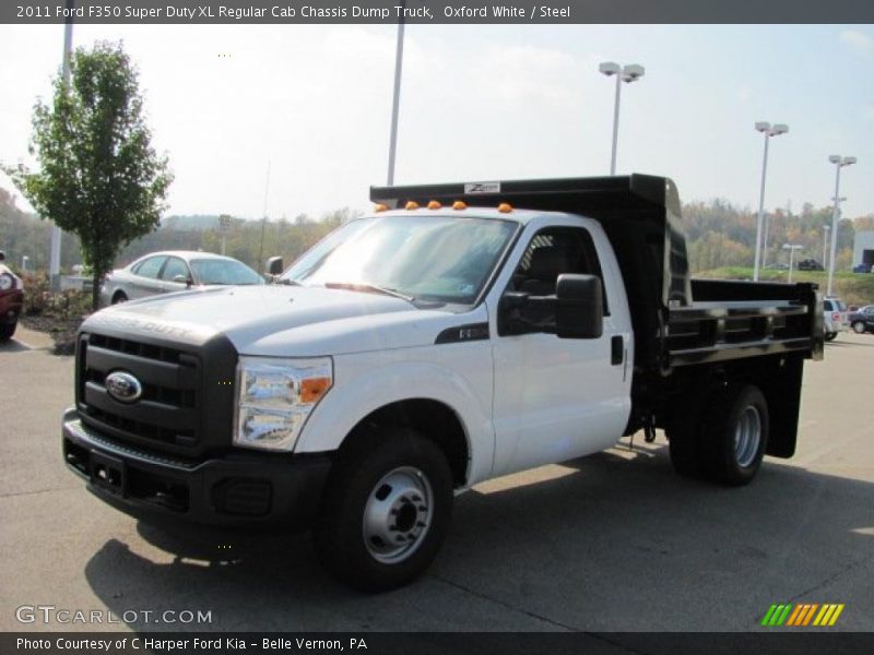Front 3/4 View of 2011 F350 Super Duty XL Regular Cab Chassis Dump Truck