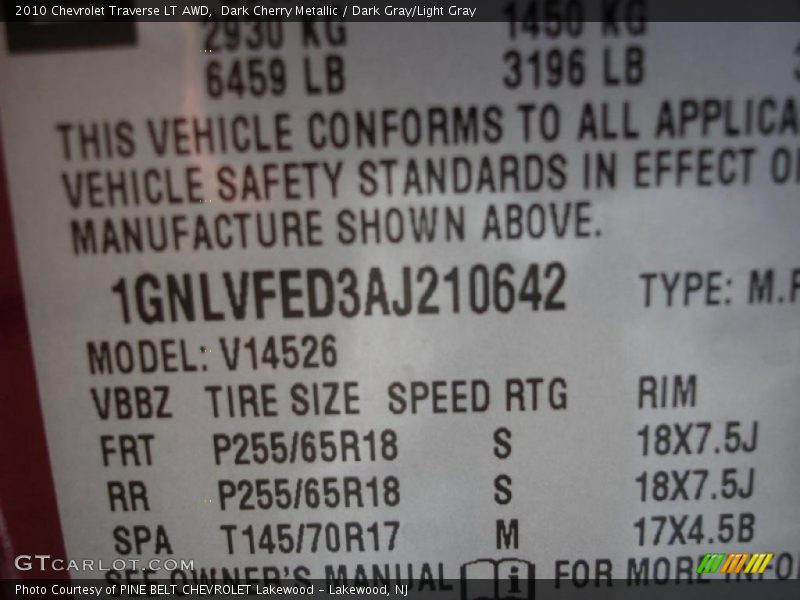 Dark Cherry Metallic / Dark Gray/Light Gray 2010 Chevrolet Traverse LT AWD
