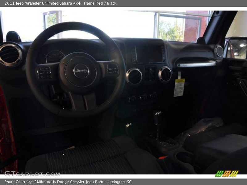 Flame Red / Black 2011 Jeep Wrangler Unlimited Sahara 4x4