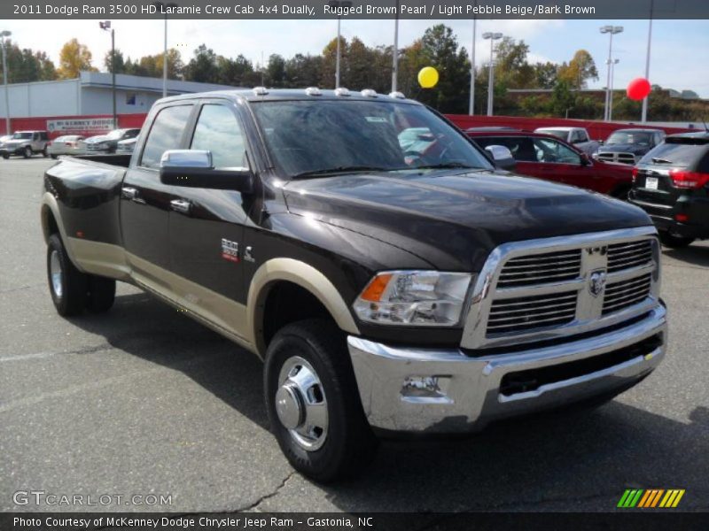 Front 3/4 View of 2011 Ram 3500 HD Laramie Crew Cab 4x4 Dually