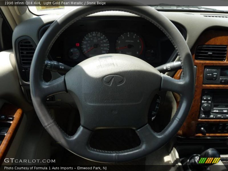 Light Gold Pearl Metallic / Stone Beige 1998 Infiniti QX4 4x4