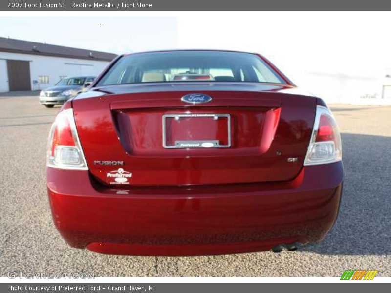 Redfire Metallic / Light Stone 2007 Ford Fusion SE