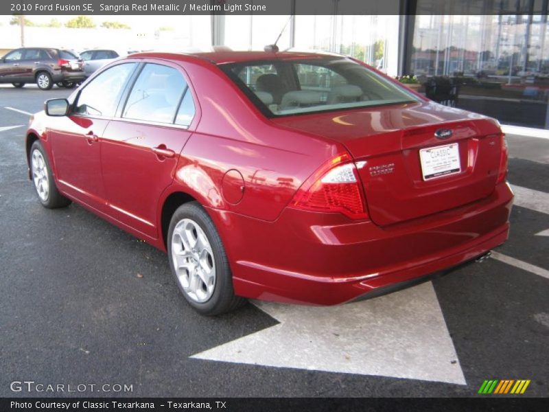 Sangria Red Metallic / Medium Light Stone 2010 Ford Fusion SE