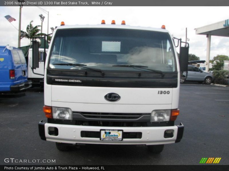 White / Gray 2006 Nissan Diesel UD 1300 Flat Bed Stake Truck