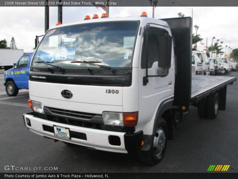 White / Gray 2006 Nissan Diesel UD 1300 Flat Bed Stake Truck