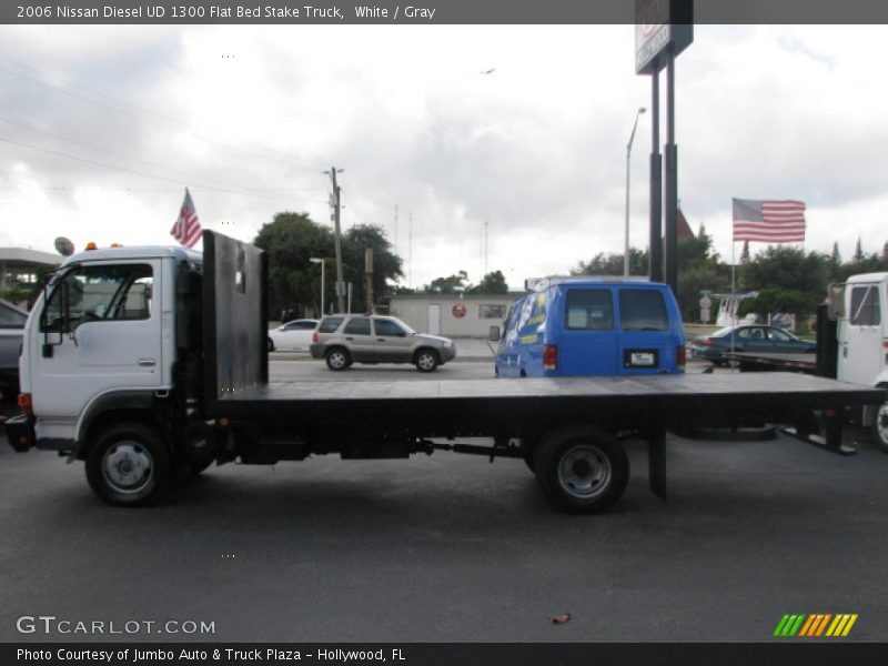 White / Gray 2006 Nissan Diesel UD 1300 Flat Bed Stake Truck