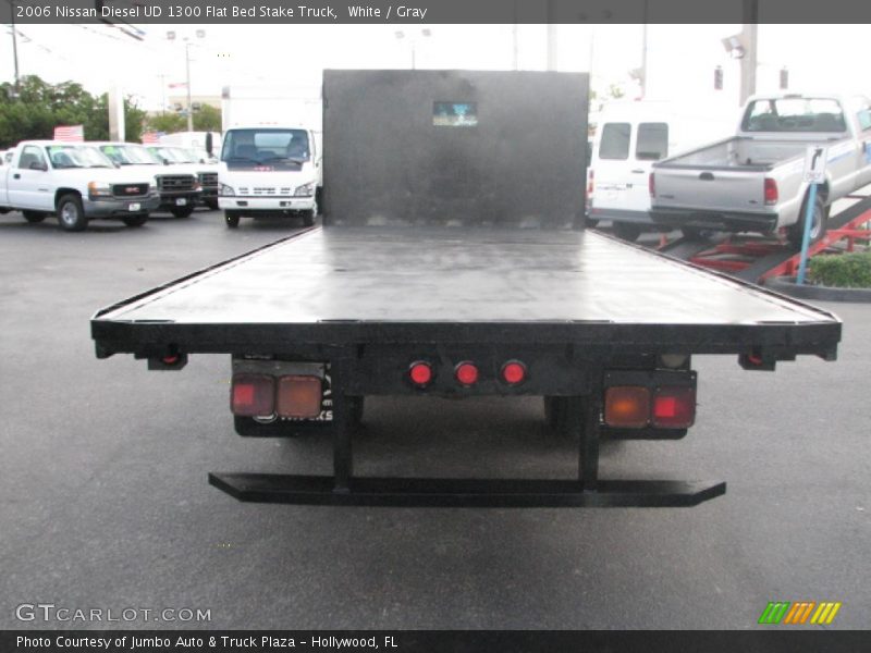 White / Gray 2006 Nissan Diesel UD 1300 Flat Bed Stake Truck