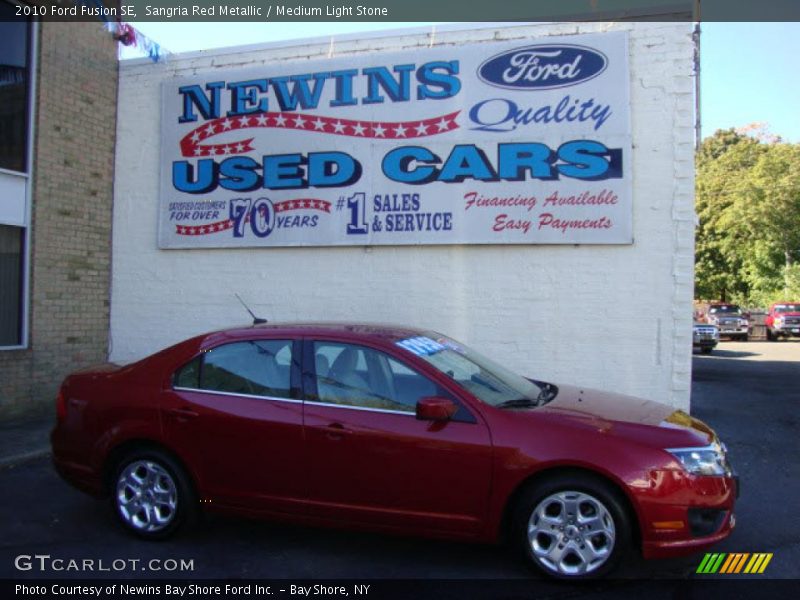 Sangria Red Metallic / Medium Light Stone 2010 Ford Fusion SE